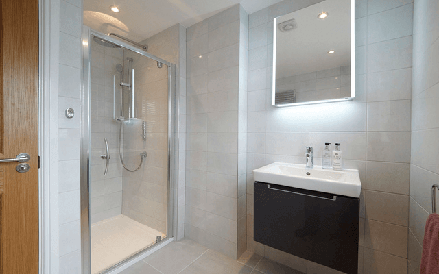 En-suite shower room in a Hollin show Home